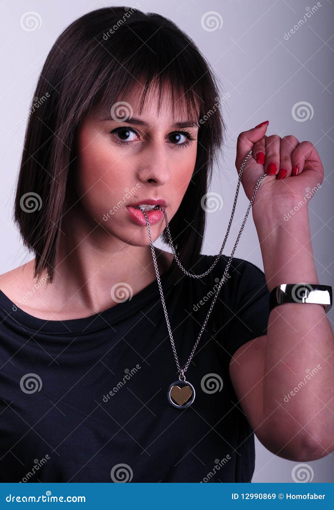 Lady holding a necklace stock image. Image of fingers 12990869