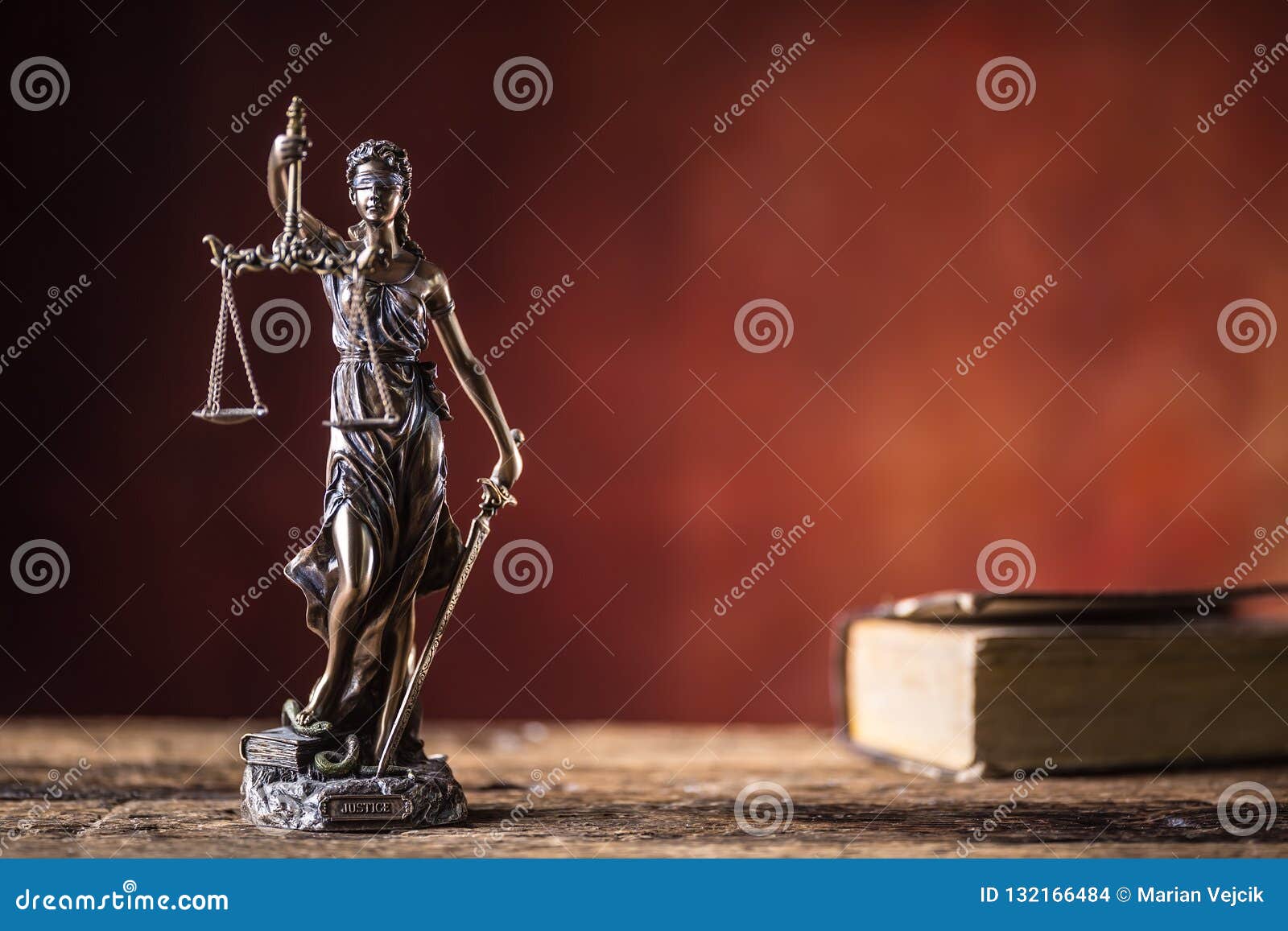 lady justicia holding sword and scale bronze figurine with book