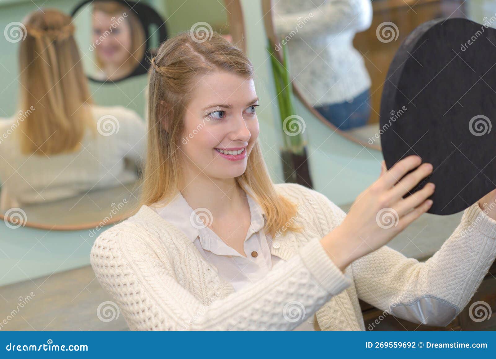 Lady Looking in Reflected Mirror To See Hairstyle Stock Photo Image