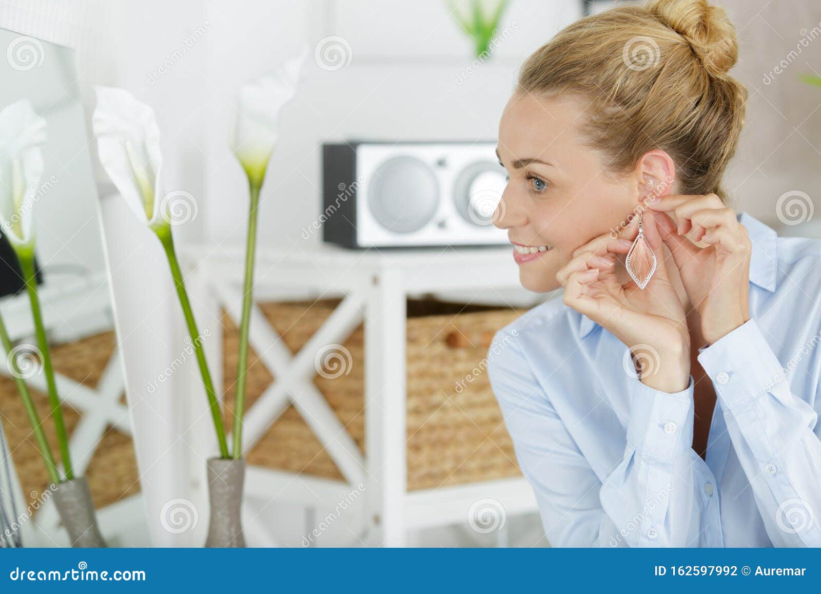 Lady Putting on Earrings in Home Stock Photo Image of head, happy