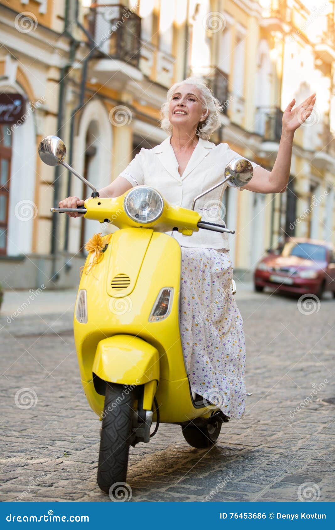 Lady on Scooter Waves Hand. Photo - Image of motorcycle, face: 76453686