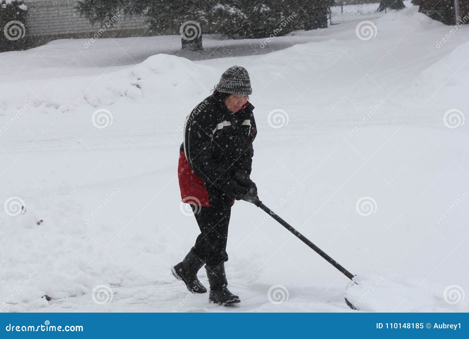 Lady Shoveling Snow stock image. Image of shovelling 110148185