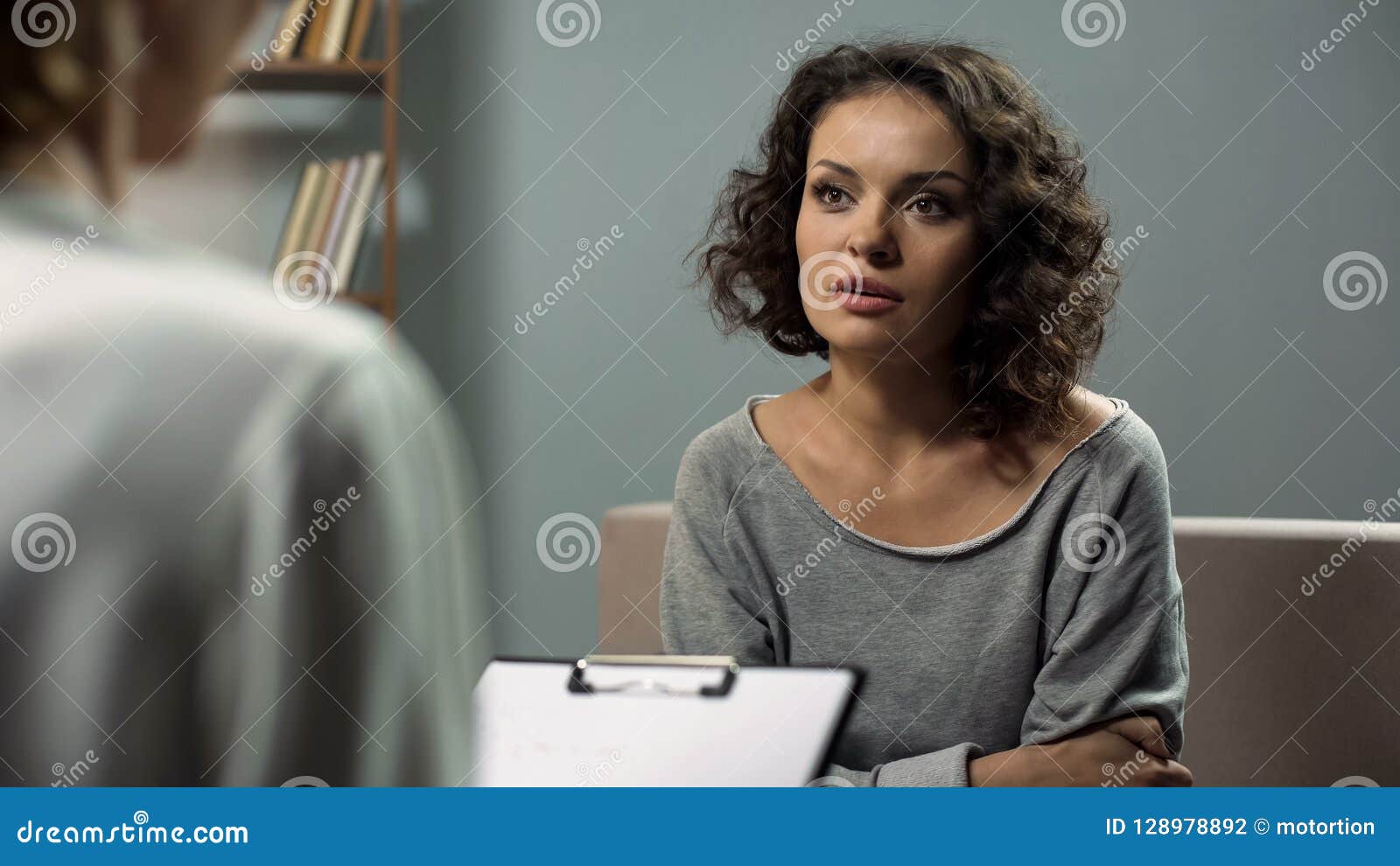 lady suffering anxiety, discussing her issues with female expert in psychiatry