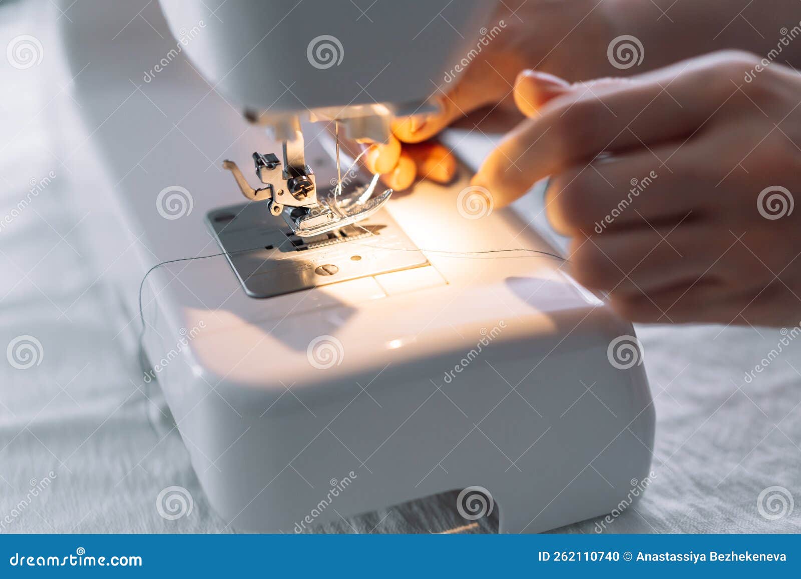 Lady Threading a Sewing Machine Needle Stock Photo Image of tailoring, seamstress 262110740