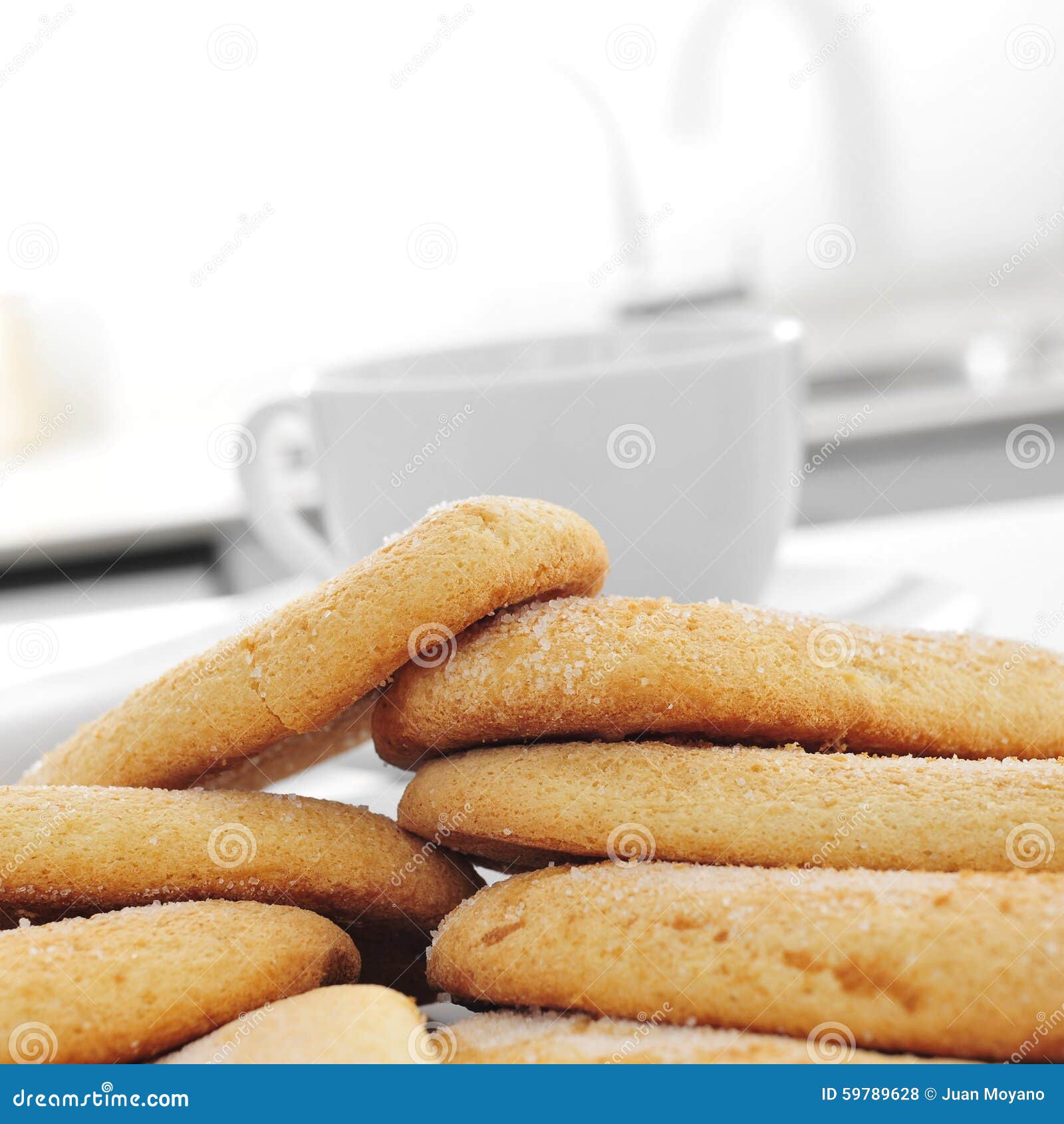 Ladyfingers and a Cup of Coffee or Tea on the Kitchen Table Stock Photo