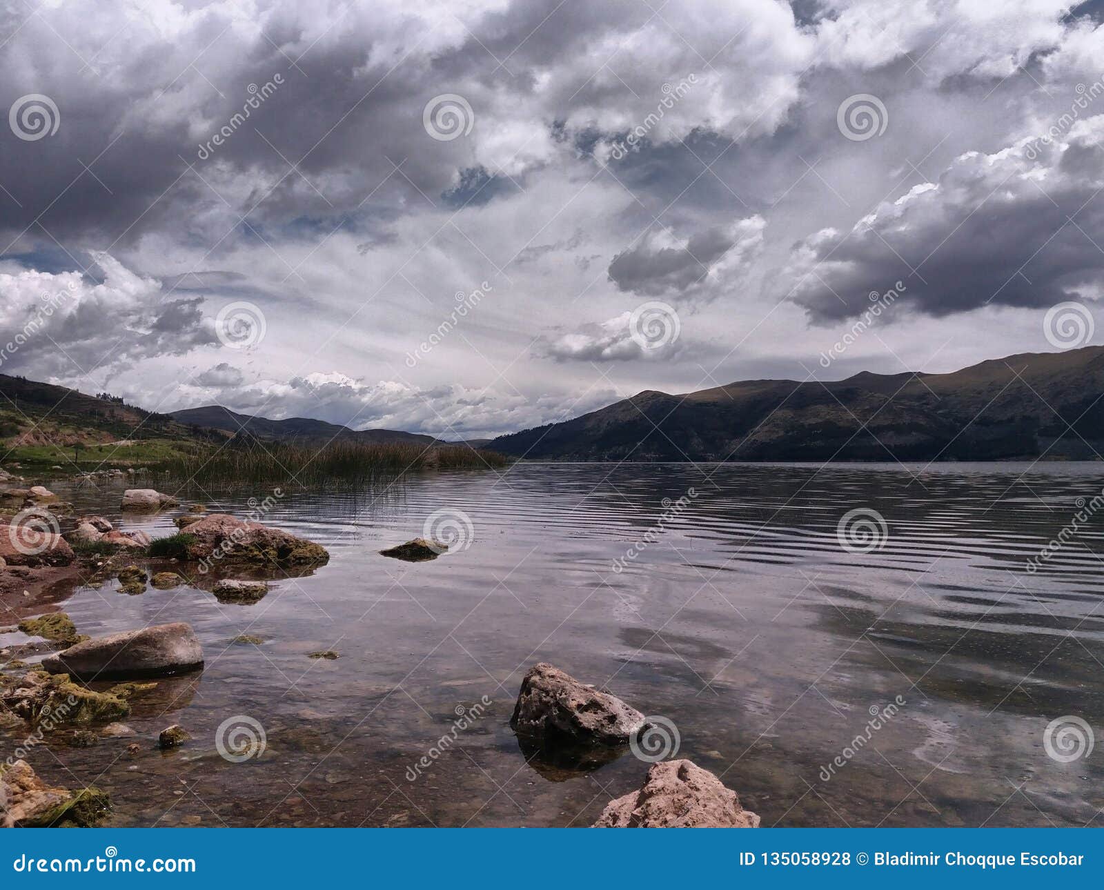 Lagoon in the Foreground with Forest and Distant Mountains Stock Photo ...