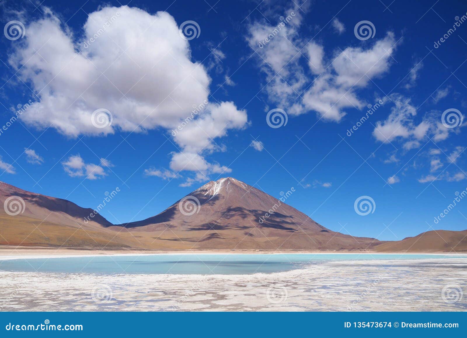 laguna verde in bolivia with scenic clouds