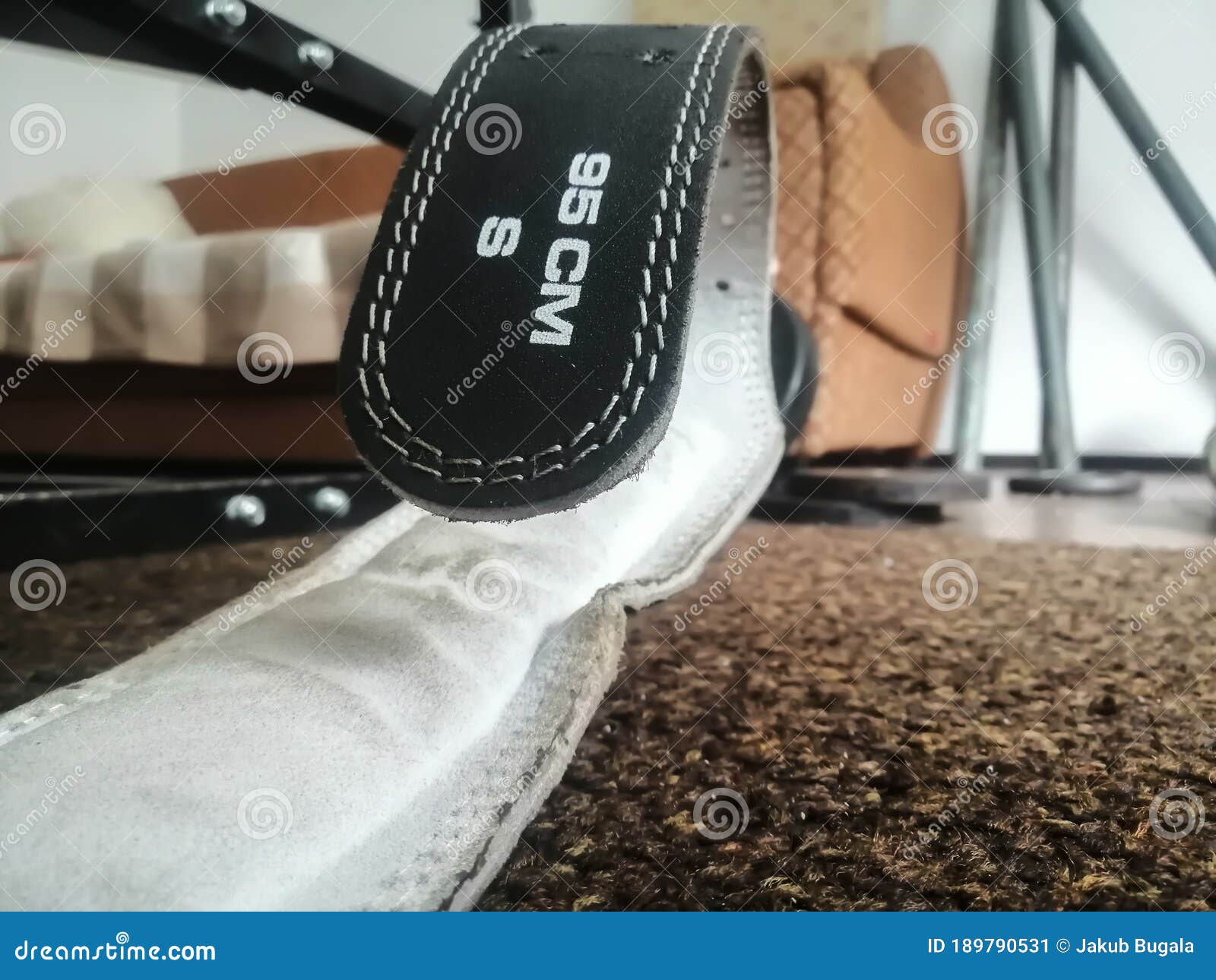 Laid Black Gym Belt on the Ground in the Home Gym Stock Image - Image