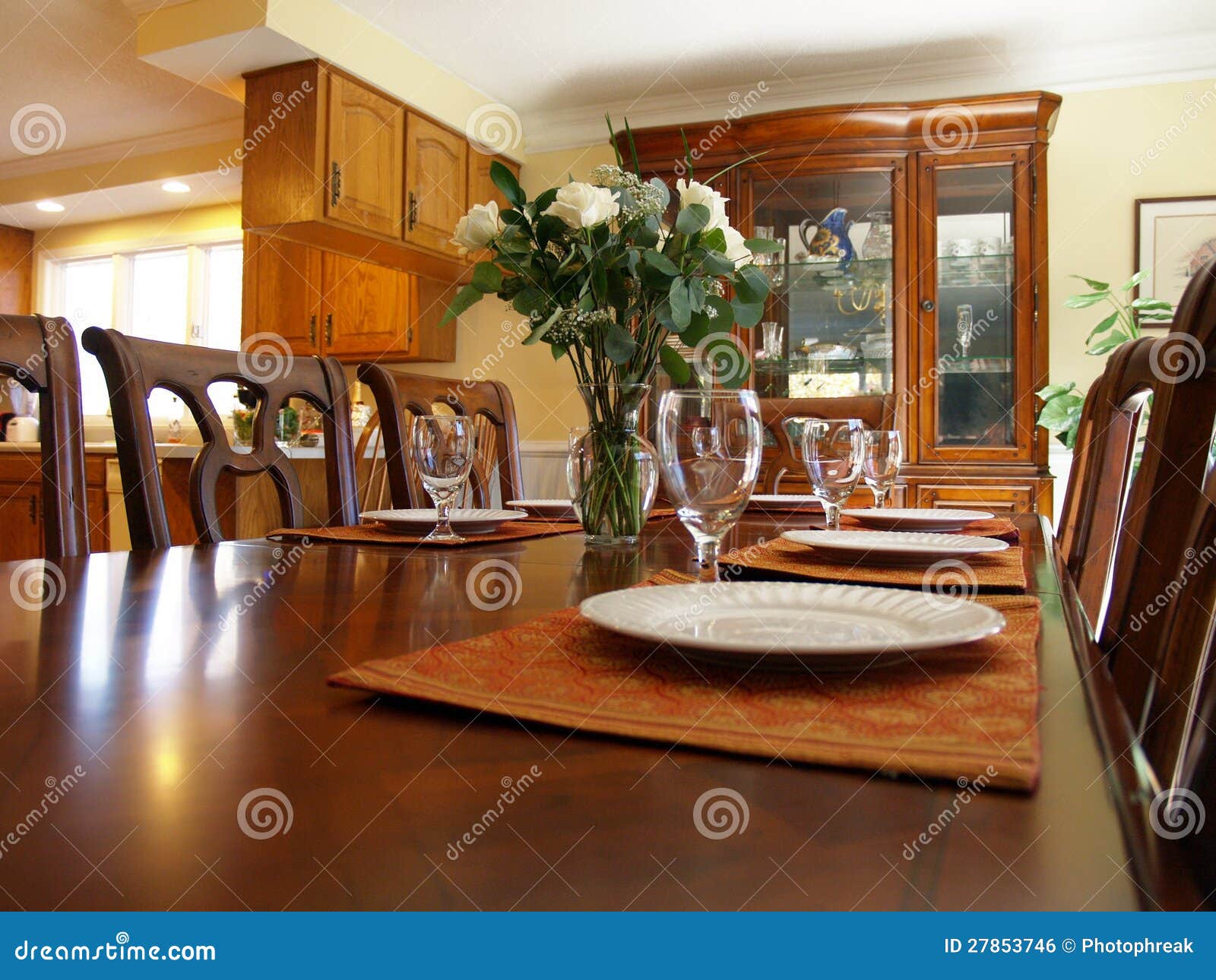 Laid table in dining room stock photo. Image of chairs 27853746