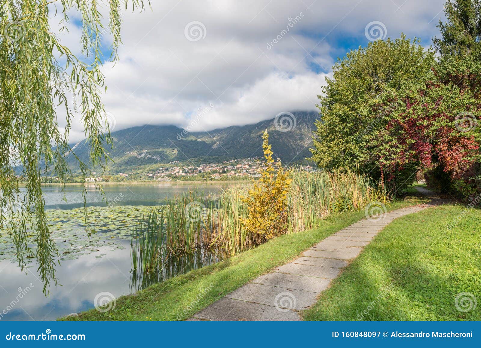 beautiful italian lake. lake annone and pedestrian cycle track