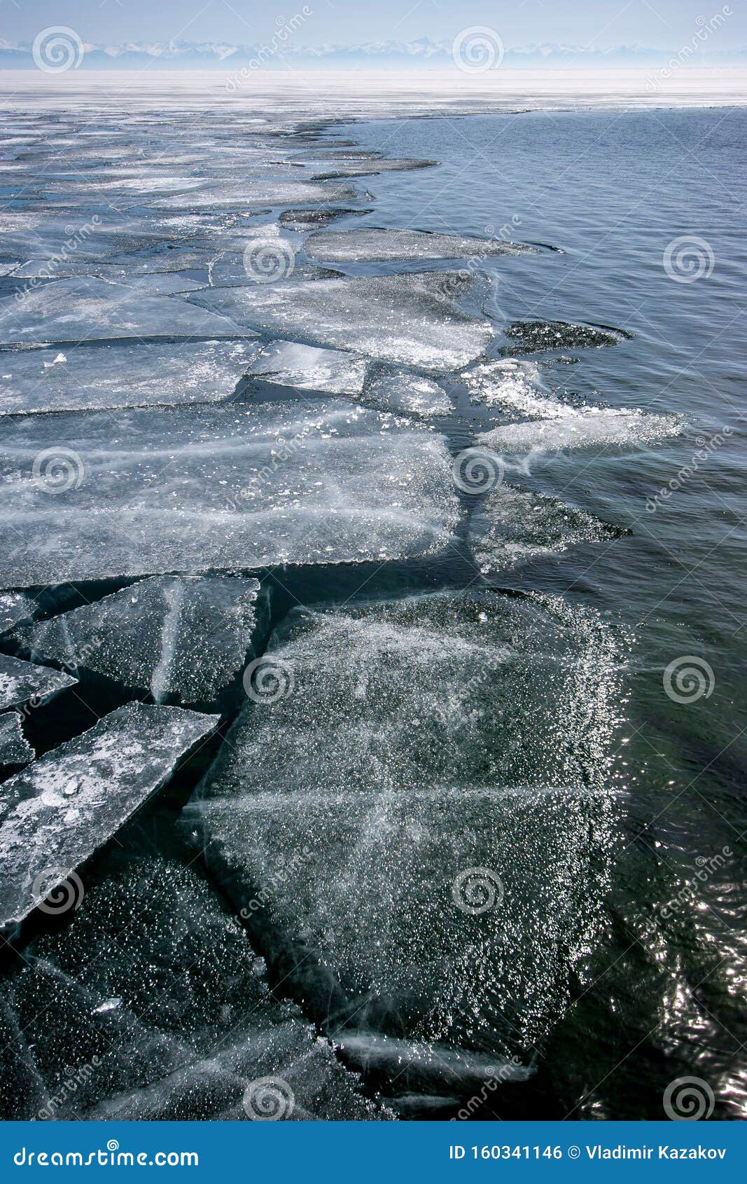 lake baikal in winter with open water and the edge of broken ice