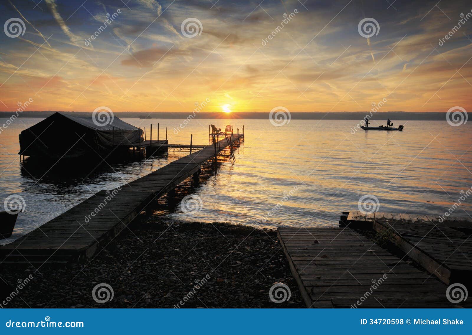 Lake Sunrise stock photo. Image of clouds, fisherman 