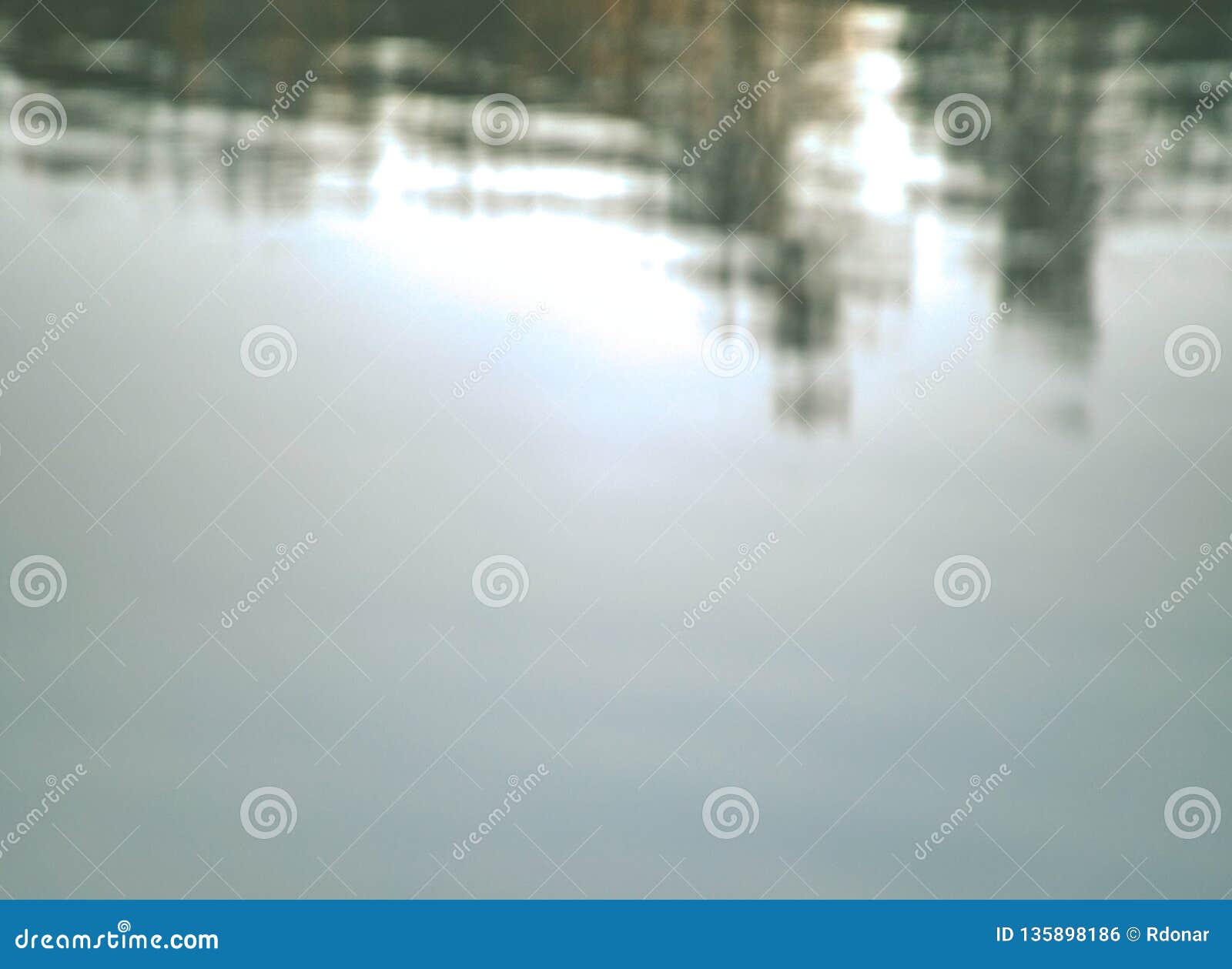 lake water is mirroring forest on oposit bank