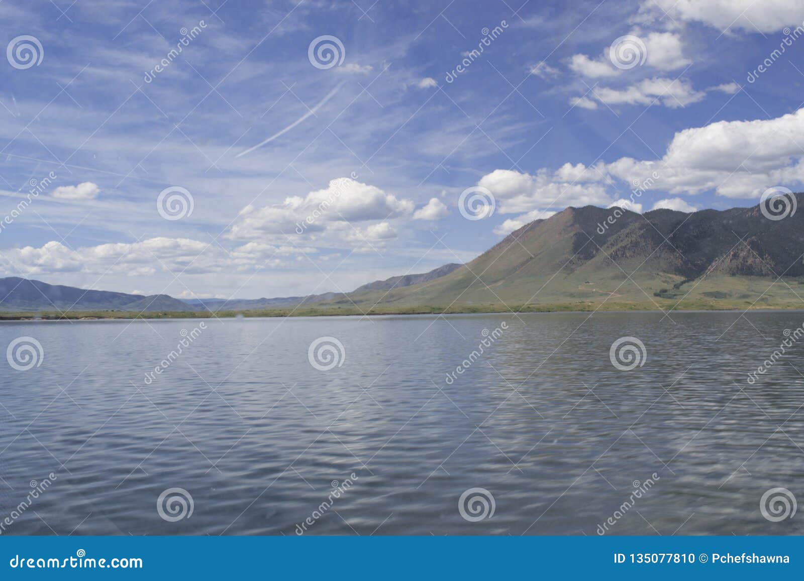 a lakefront view of sheep mountain from lake hattie, laramie, wyoming