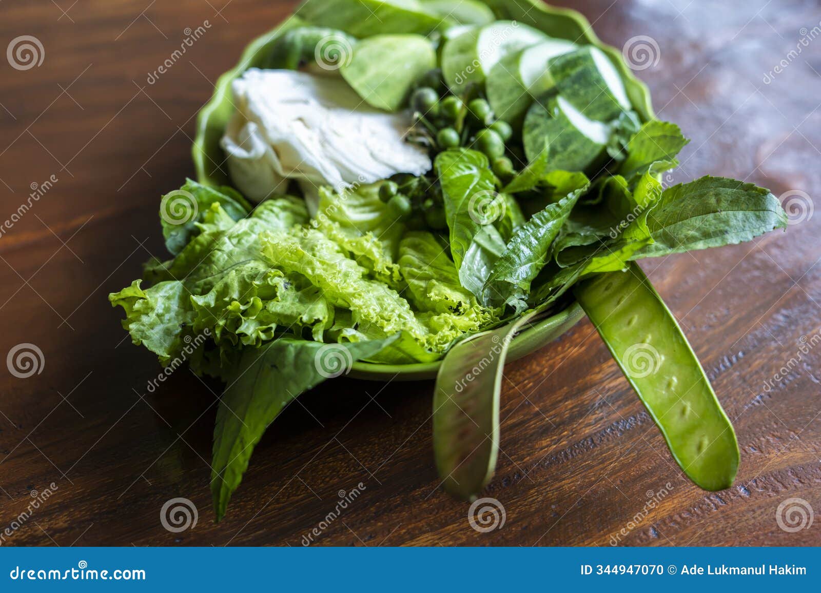 lalapan or fresh raw vegetables basket. eaten with chili sauce as a complementary food. authentic indonesian food