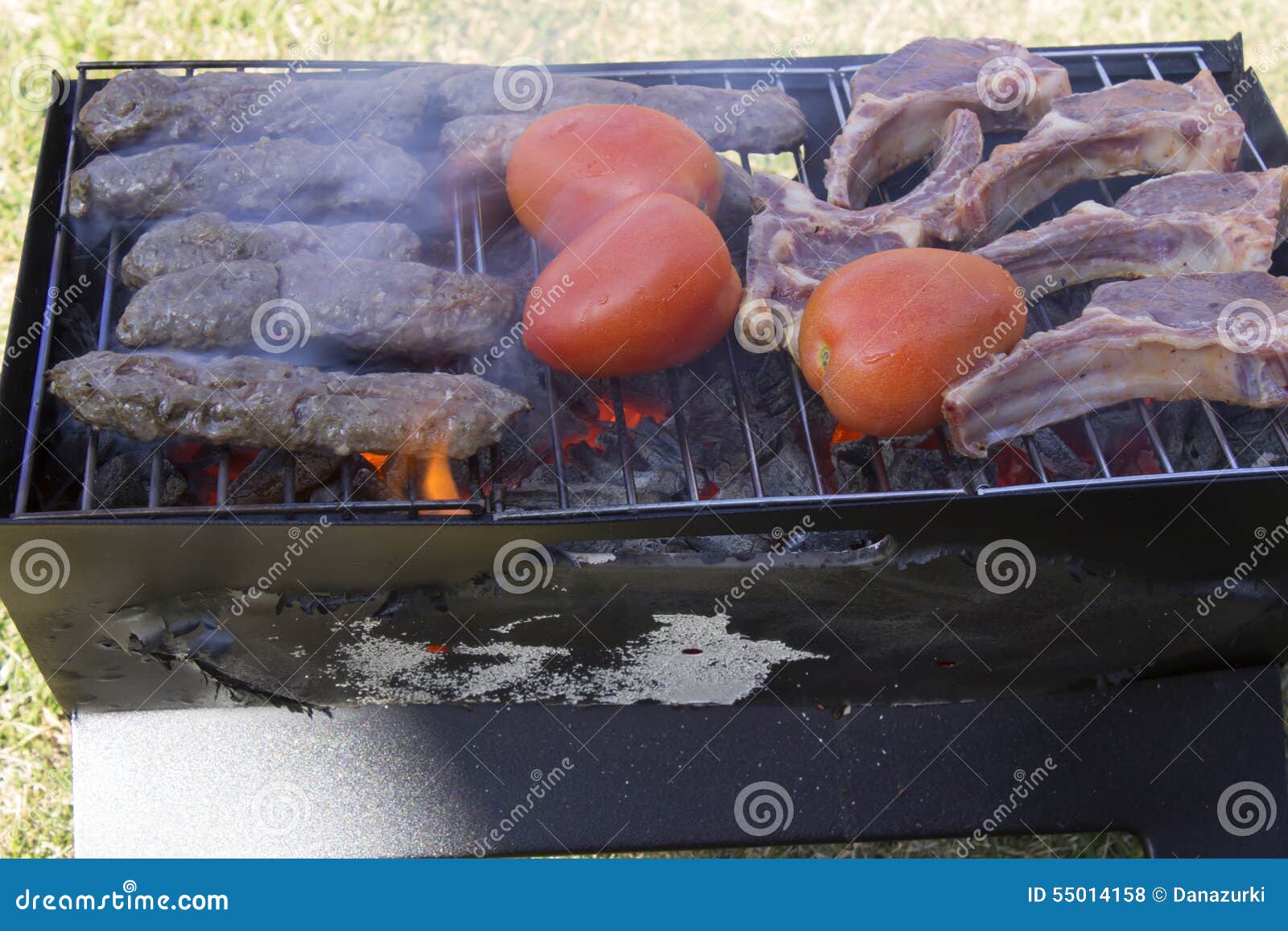 Lamb Chops, Kabobs and Tomatoes on a Charcoal Grill Stock Photo Image