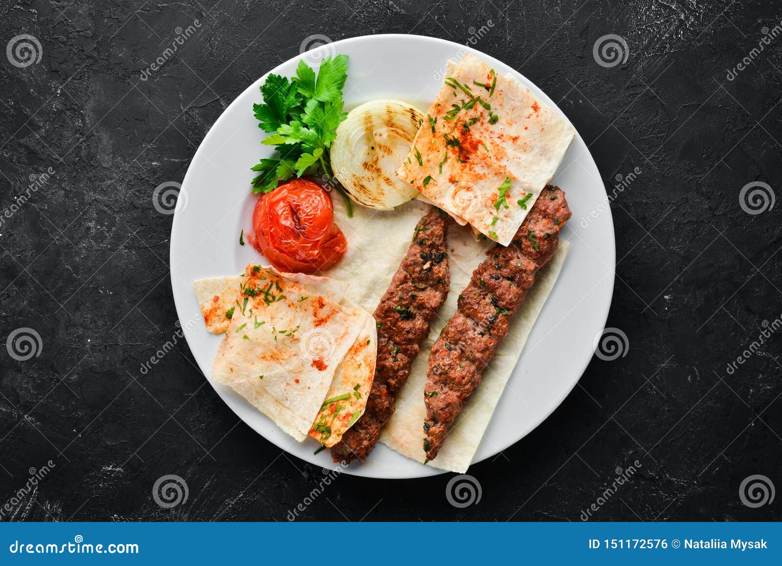 Lamb Kebab. Pita Bread and Spices. on a Black Background Stock Photo