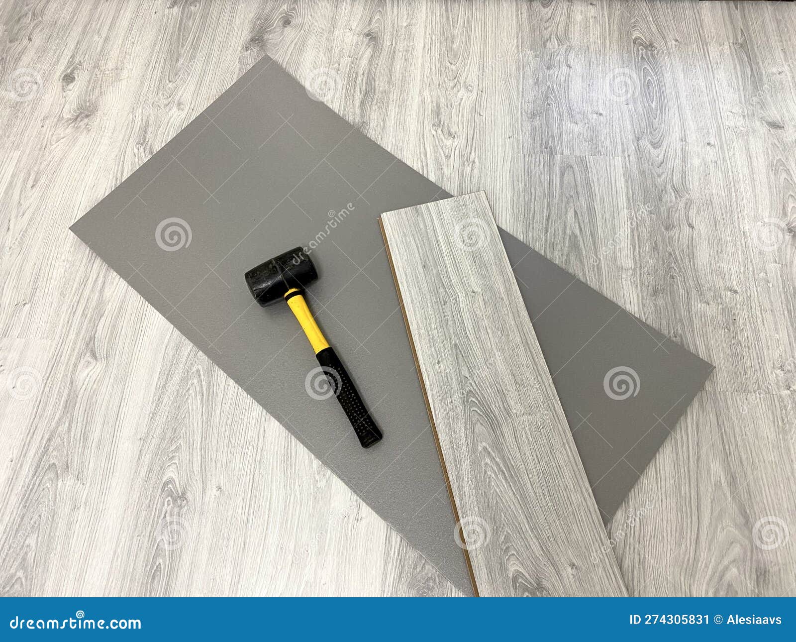 Laminate Floor Laying Tool, Underlay, Board and Hammer Stock Image
