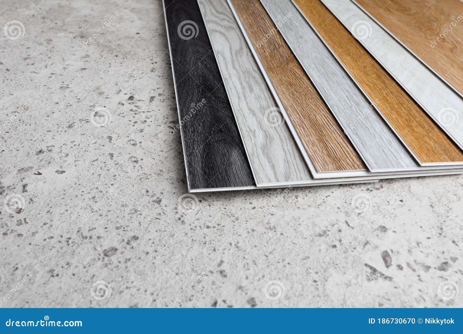 Laminate Flooring Planks Variations on Concrete Floor Stock Photo