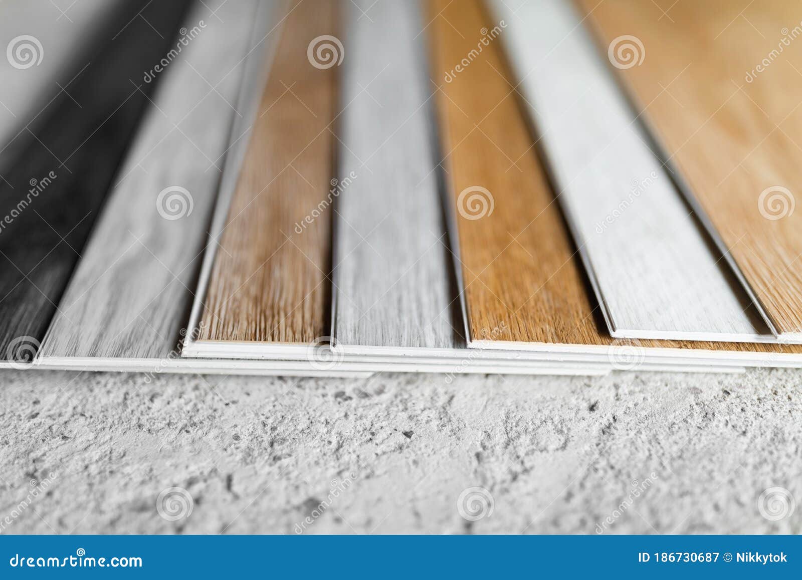 Laminate Flooring Planks Variations on Concrete Floor Stock Image