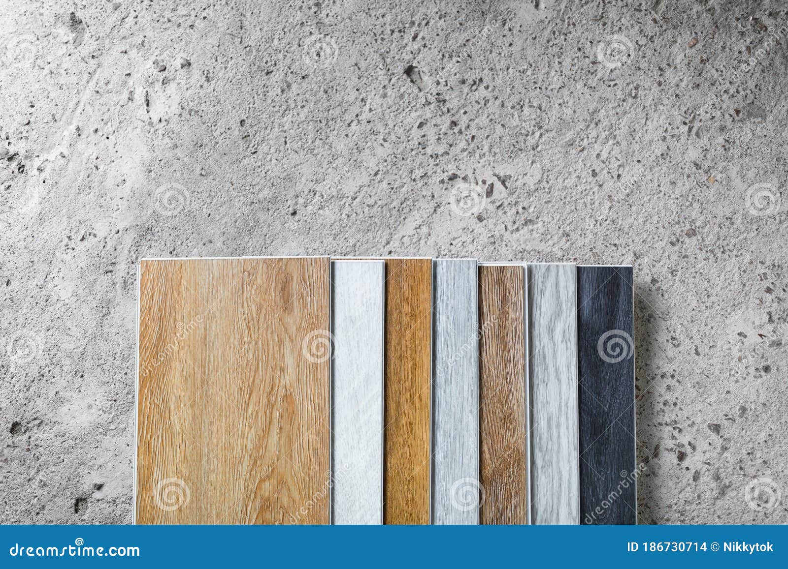 Laminate Flooring Planks Variations on Concrete Floor Stock Photo