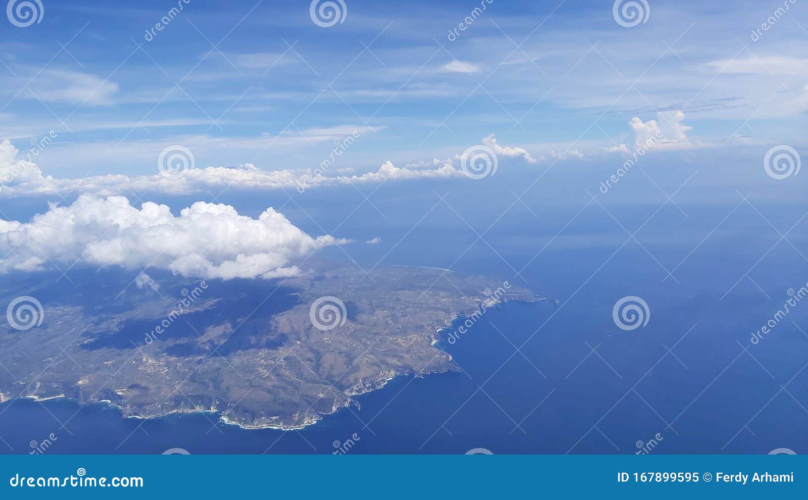 Land view from airplane stock image. Image of clouds 167899595