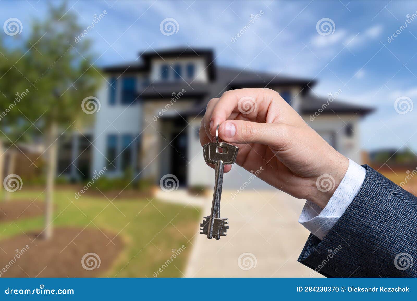Landlord Unlocks the House Key for New Home. Stock Photo Image of