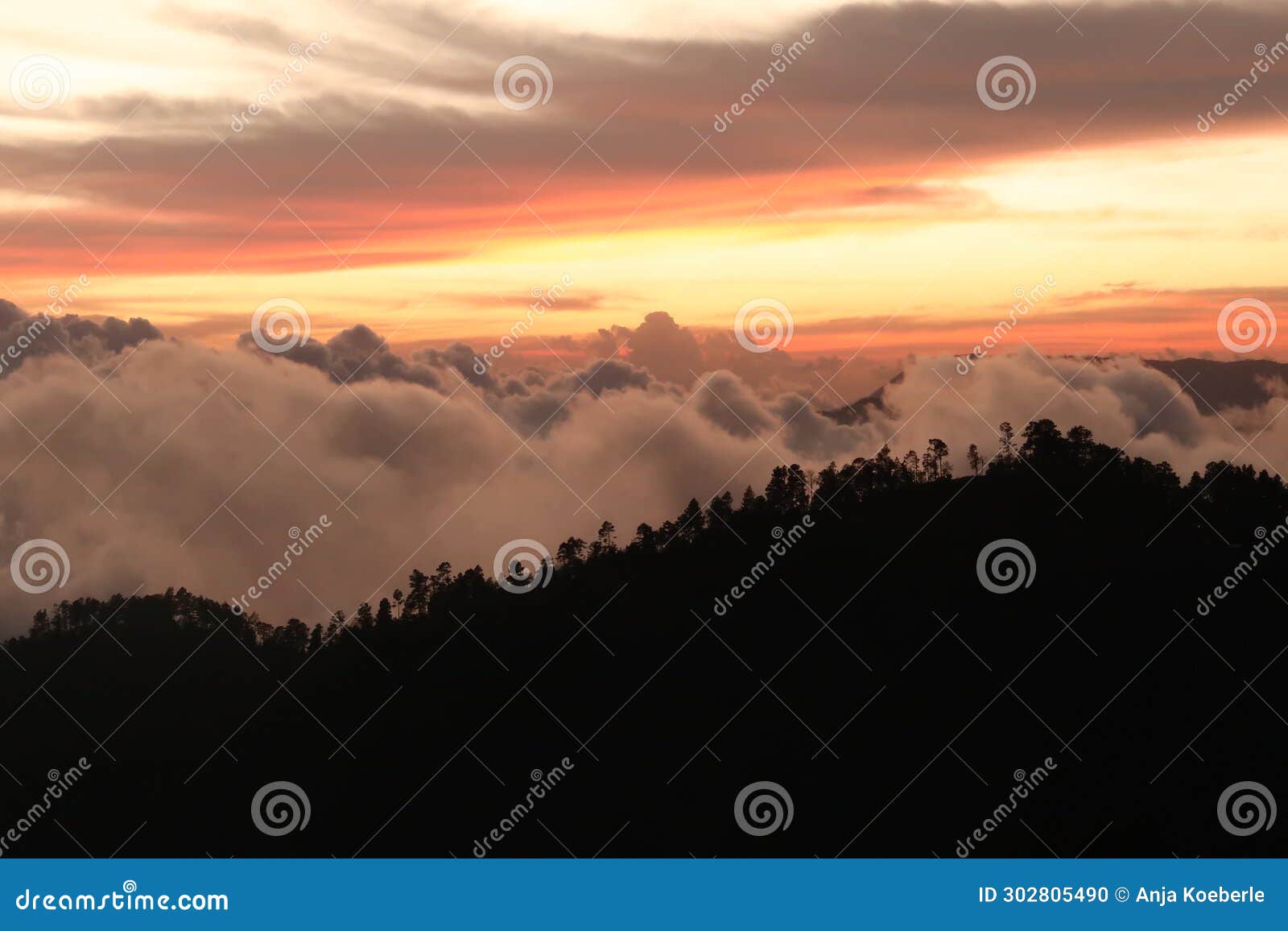 the landscape around san jose del pacifico at sunset, clouds, hills and a colorful sky, oaxaca, mexico