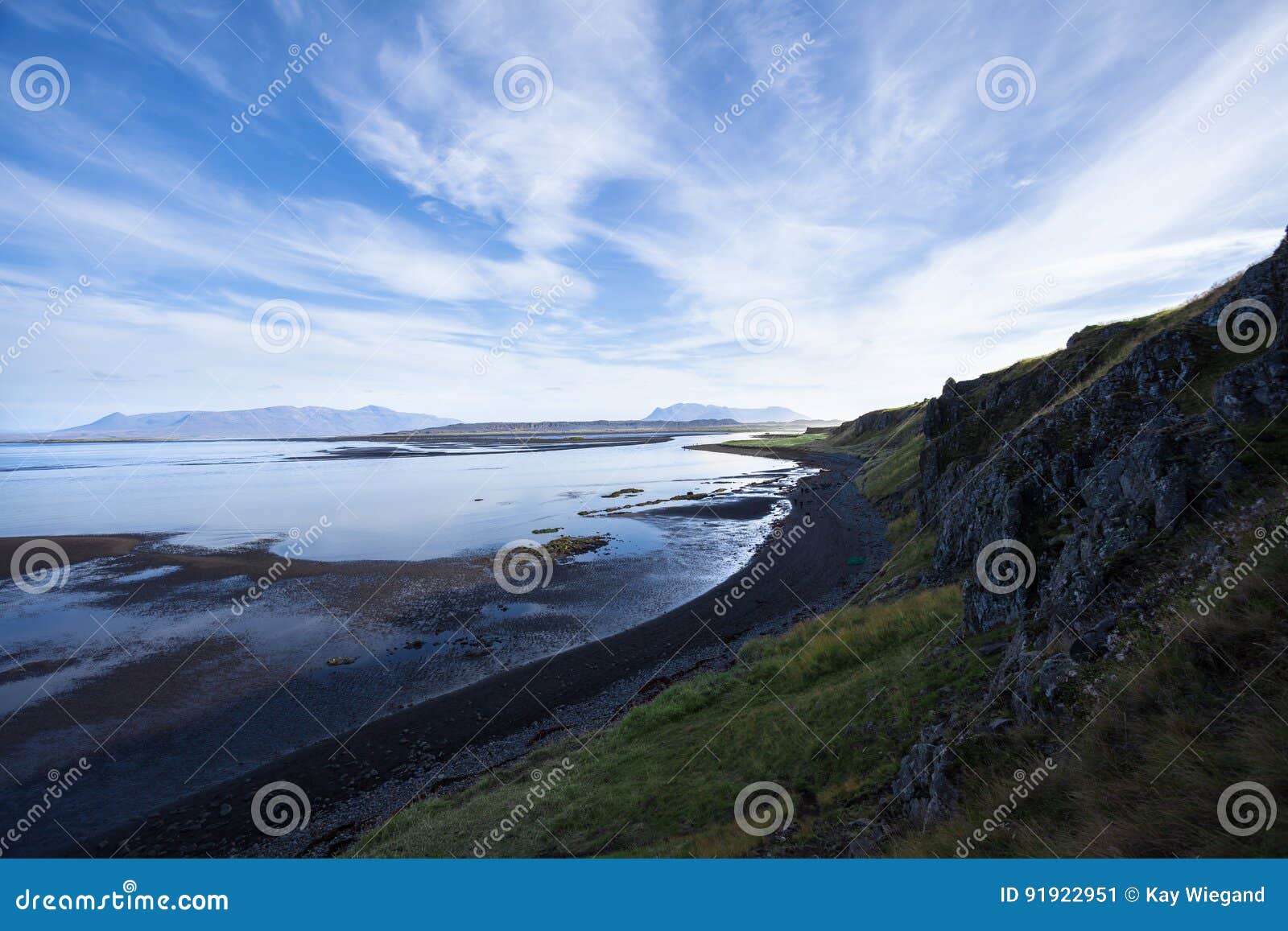 Landscape With Cliff And Mountain Range At The Ocean Light Reflections