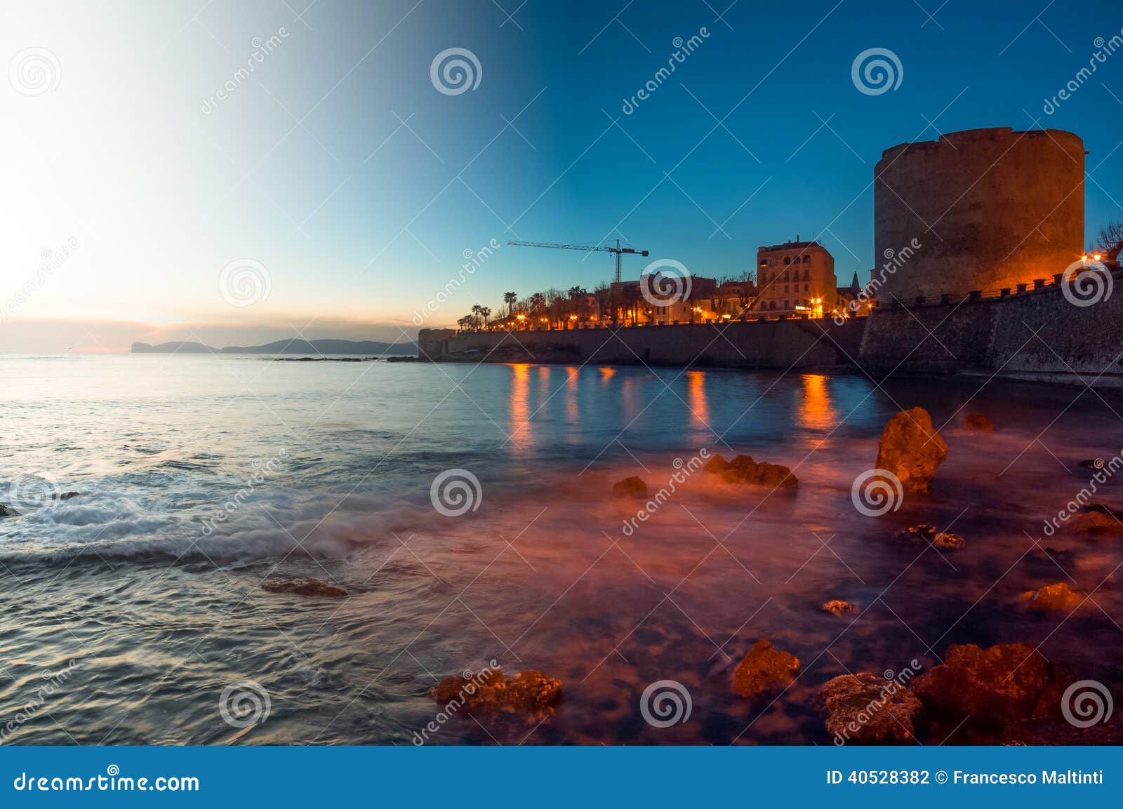 The sunset is reflected on the Beach of Masua, Iglesias