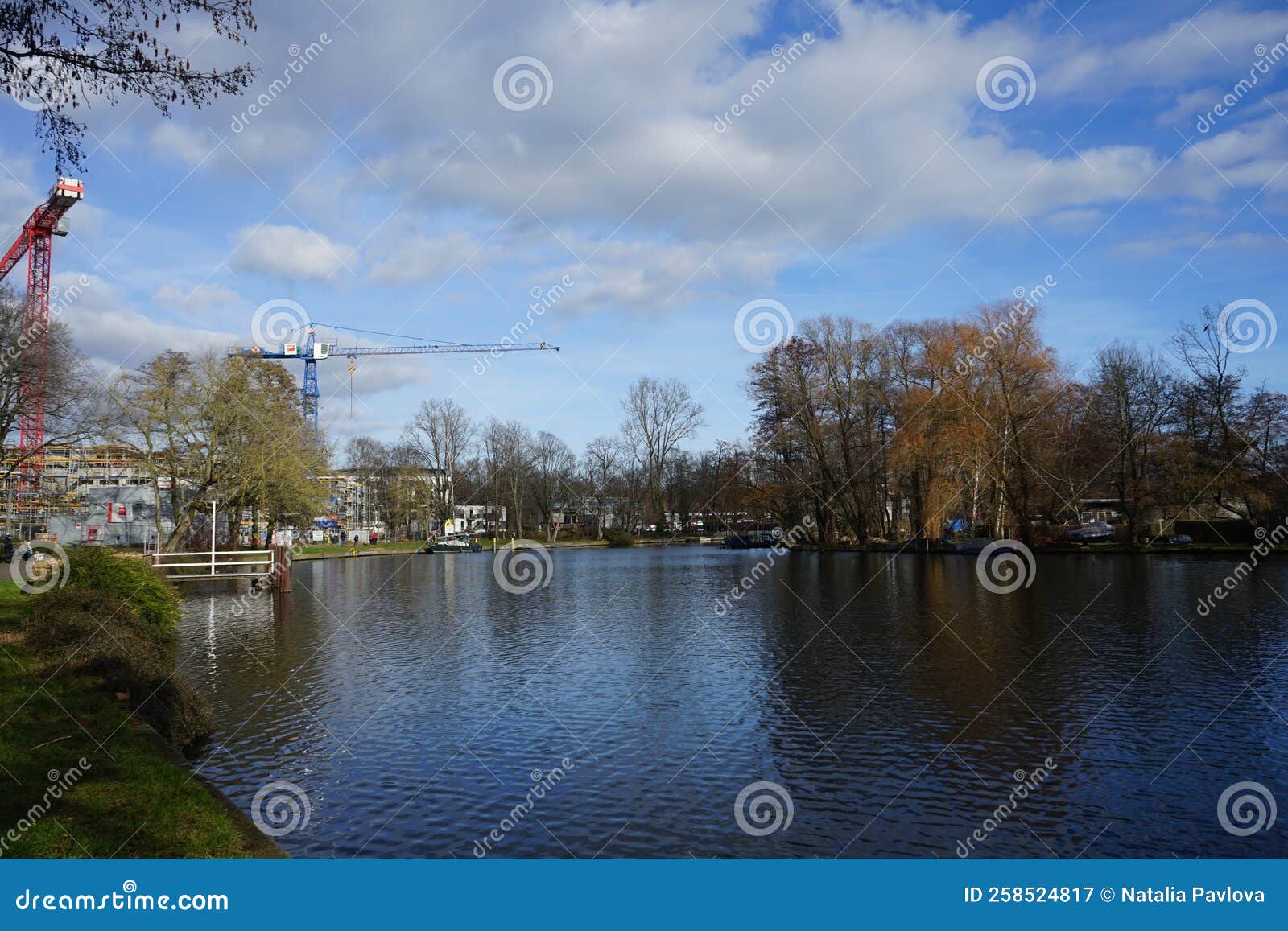 view of the spree river and baumgarteninsel island from platz des 23. april, berlin, germany