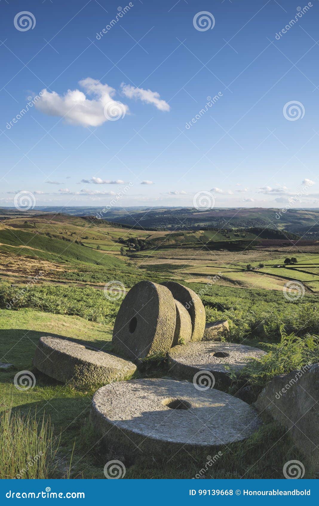 summer landscape image of millstones on top of stanage edge in p