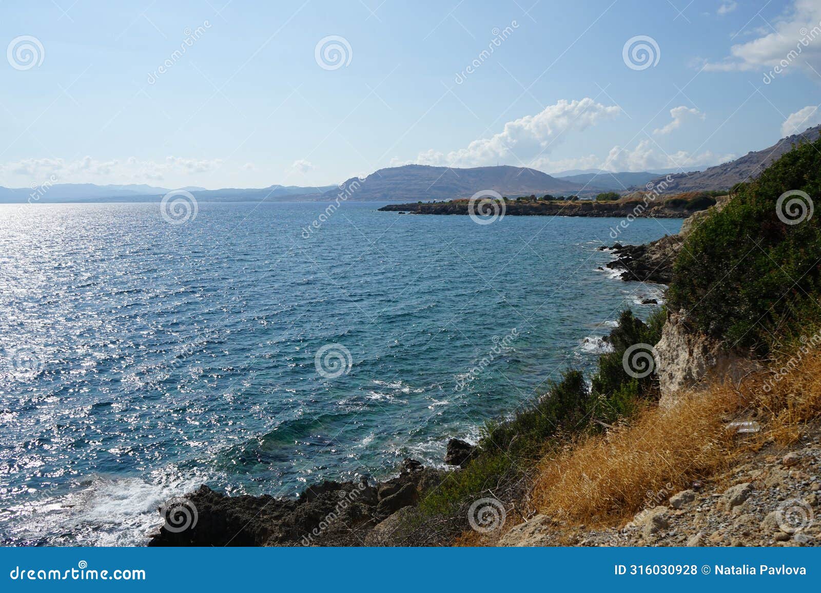 view of the mediterranean coast in the vicinity of pefki in august. pefkos or pefki, rhodes island, greece