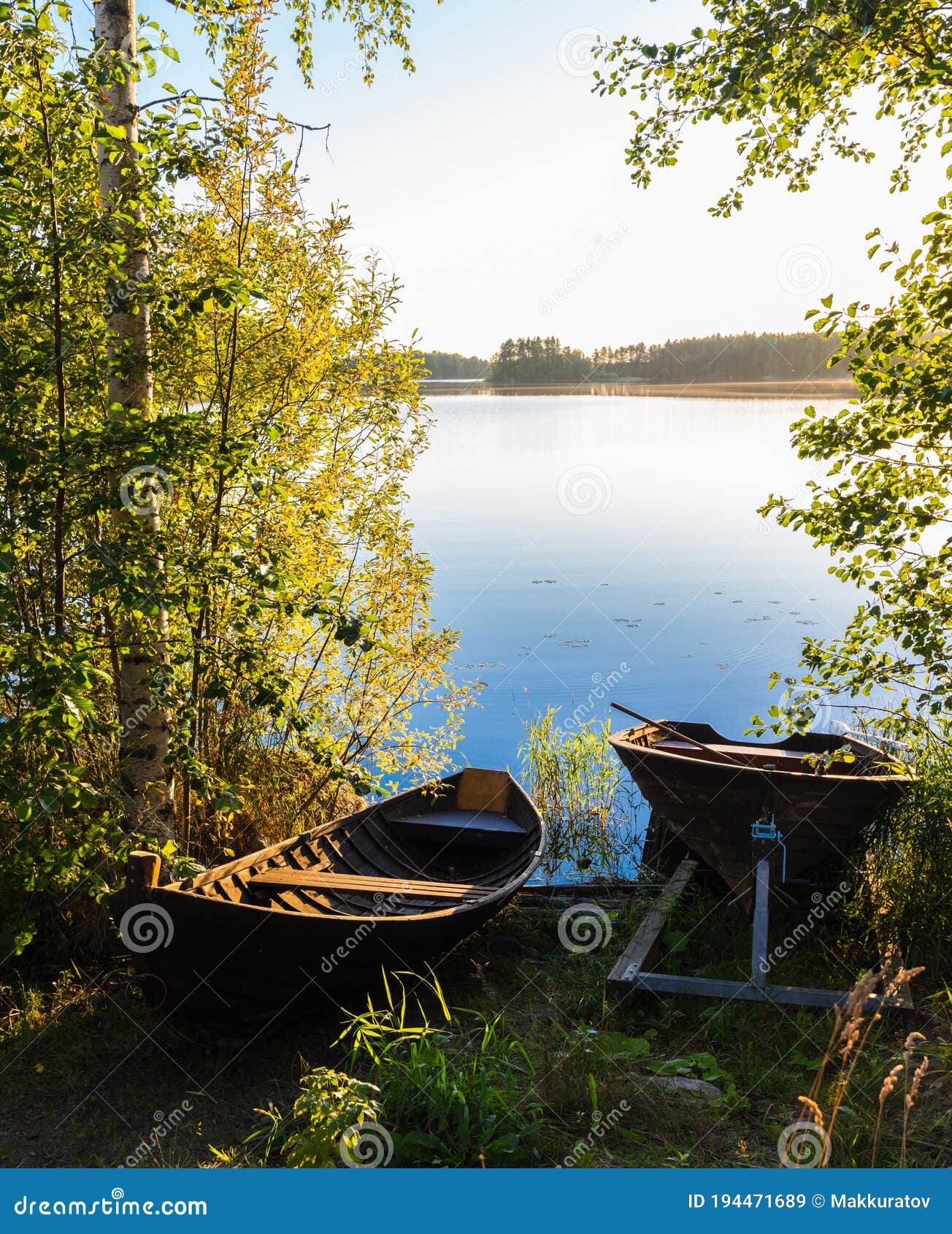 landscape of the lake with a boat in the foreground. vertical fr