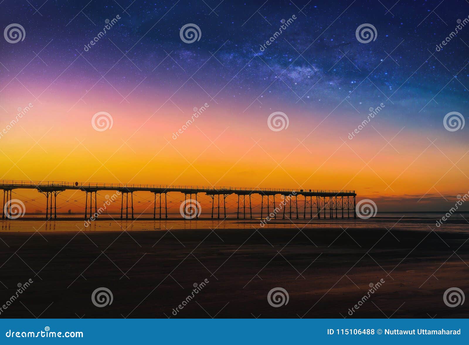 landscape with milky way galaxy and sunset over pier at saltburn by the sea, north yorkshire, uk.