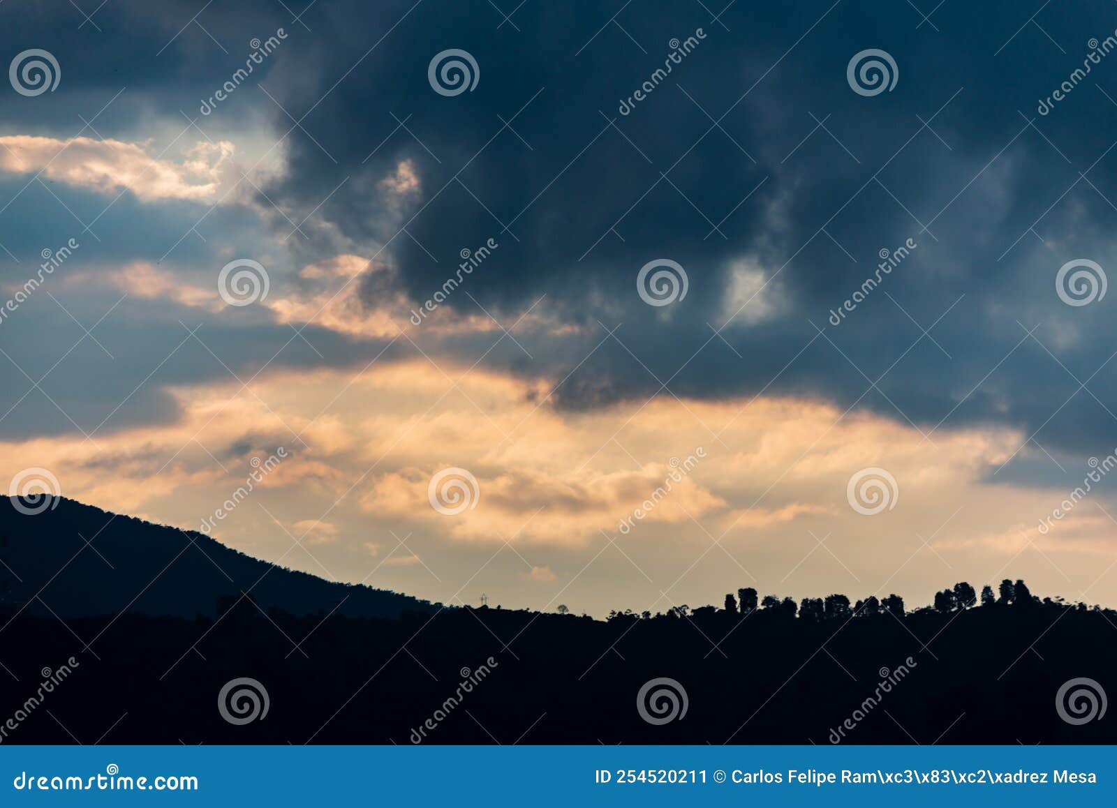 landscape with mountains and sky with stromy clouds