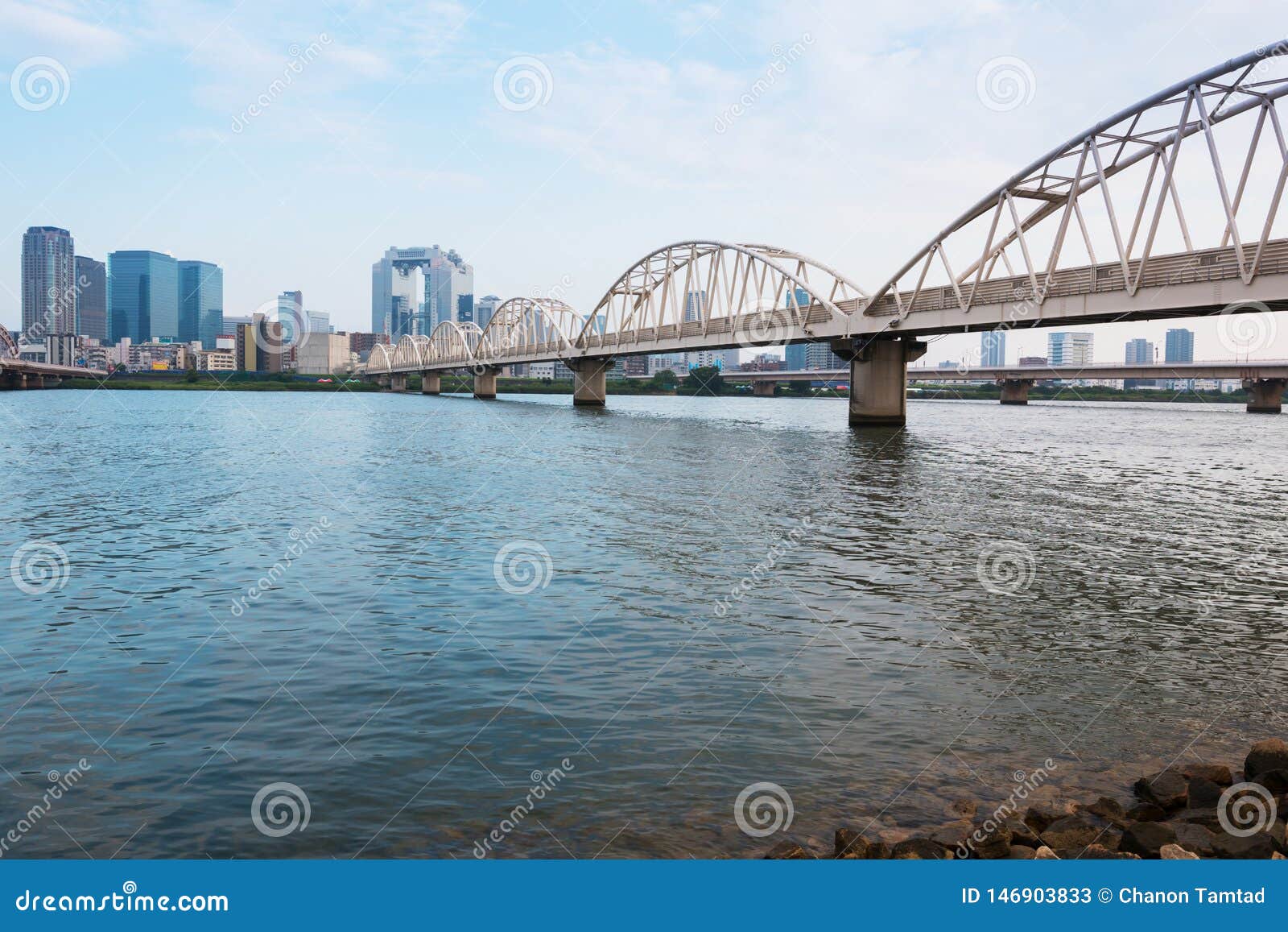 landscape of osaka city at umeda from across the yodogawa river