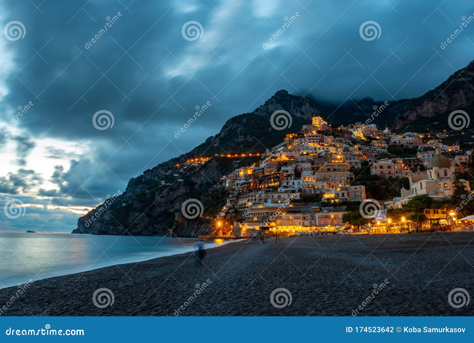 landscape with positano town at famous amalfi coast at sunset, italy