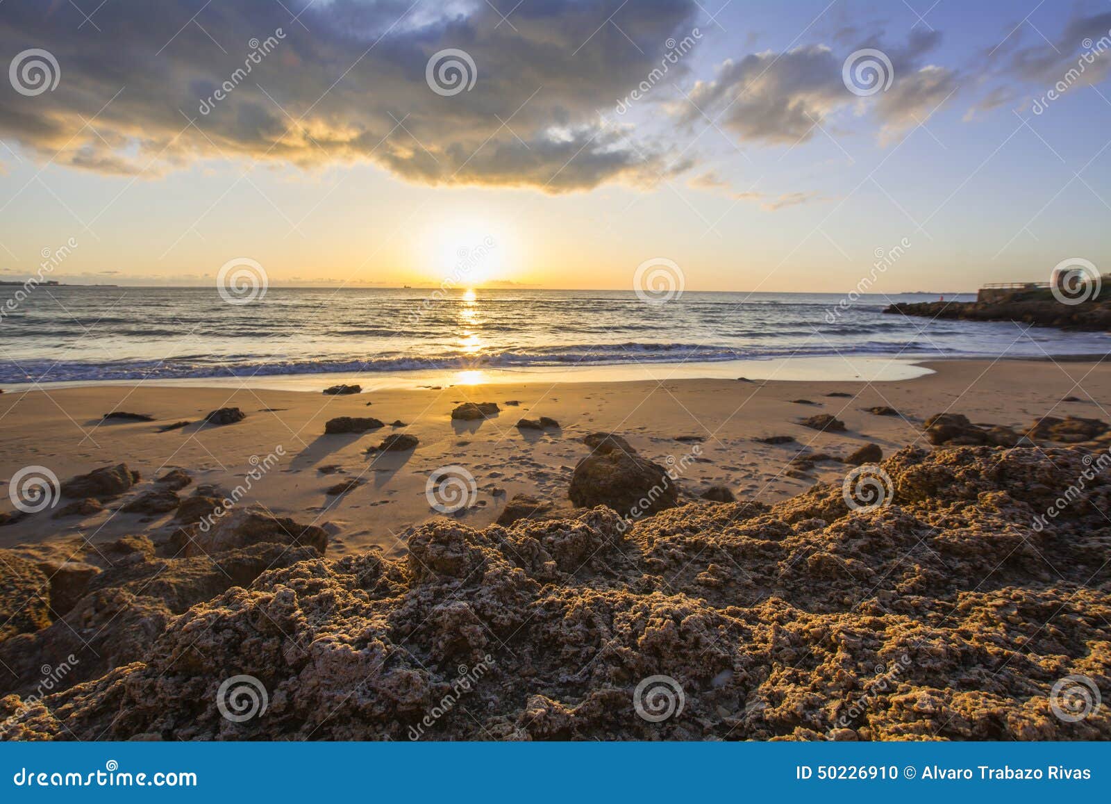 landscape of rocky beach at sunset