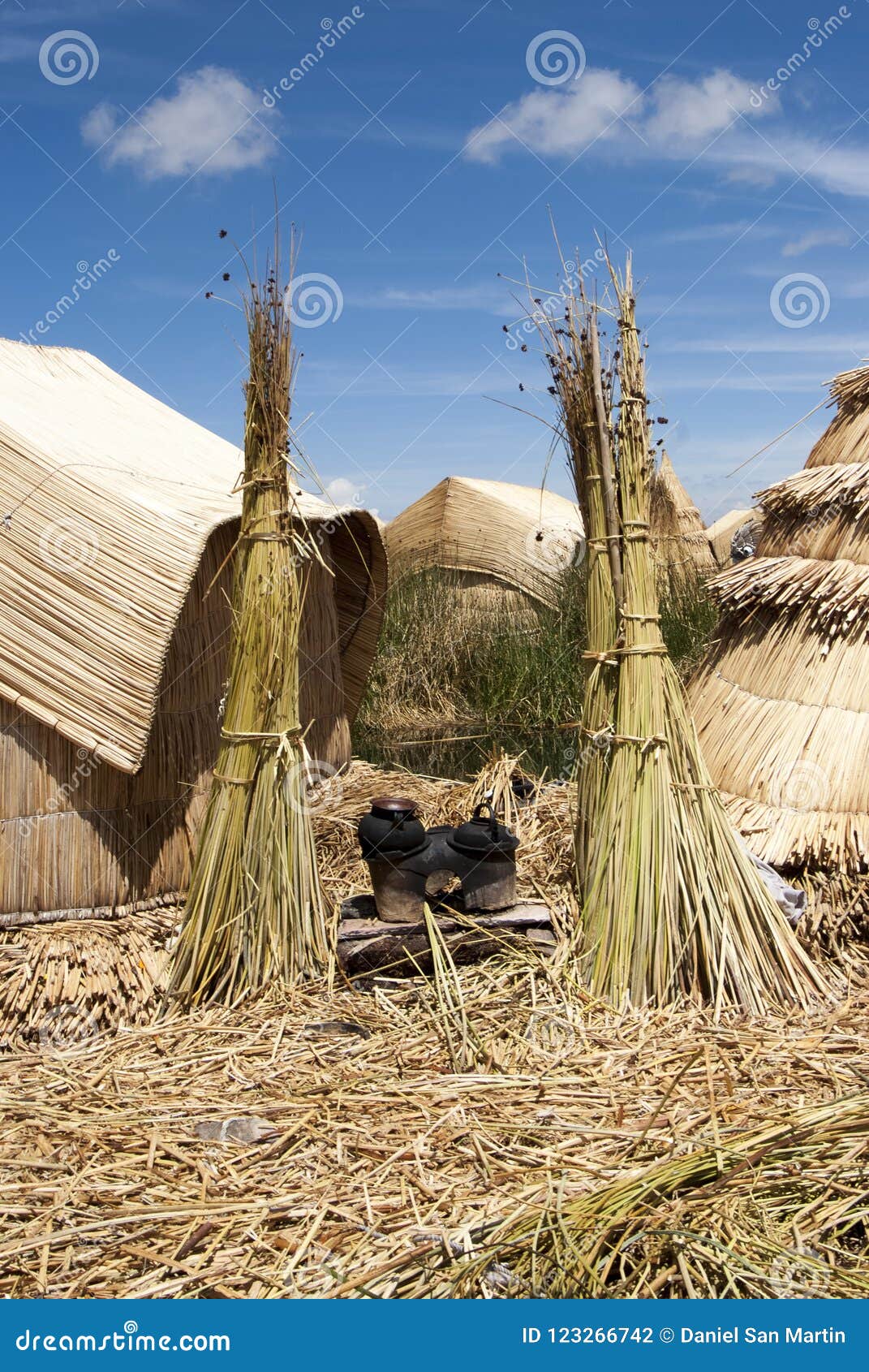 landscape of the uros floating islands in the magic blue colors of the titicaca lake with the andes mountain range in