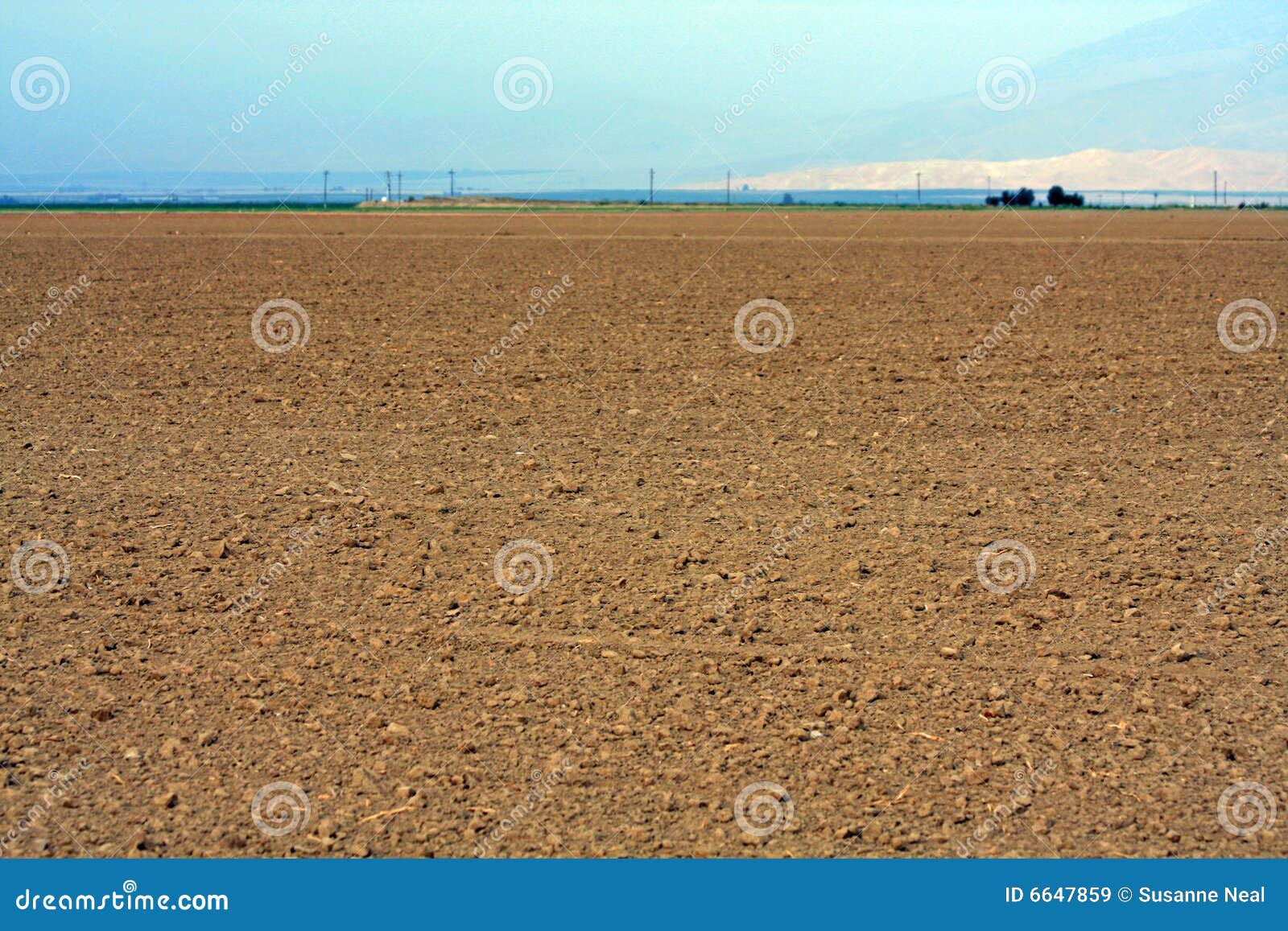 landscape view of a dirt field and sky