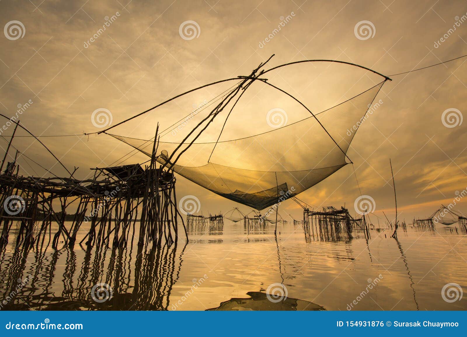 https://thumbs.dreamstime.com/z/landscape-view-giant-fish-lift-net-sunrise-golden-sky-reflection-canal-travel-long-tail-boat-local-style-pakpra-154931876.jpg