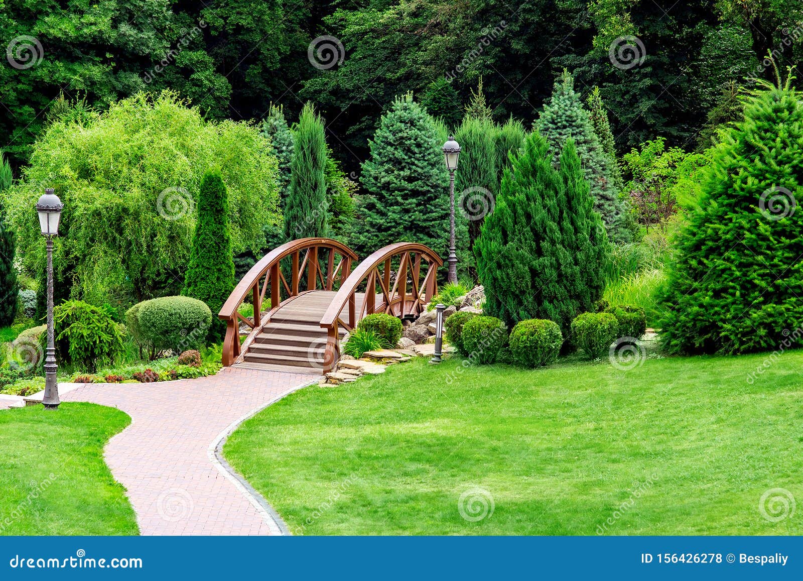 Landscaping of a Park in the Backyard with a Footpath. Stock Photo