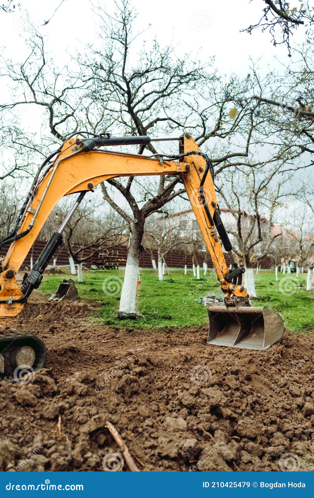 Landscaping Works at Home Construction Site Using Excavator and Mini