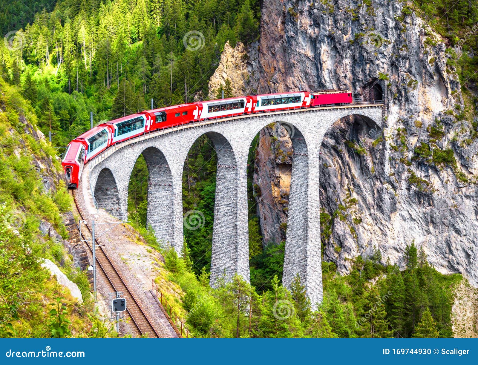 landwasser viaduct in filisur, switzerland. it is landmark of swiss alps. bernina express train on railroad bridge in mountains.