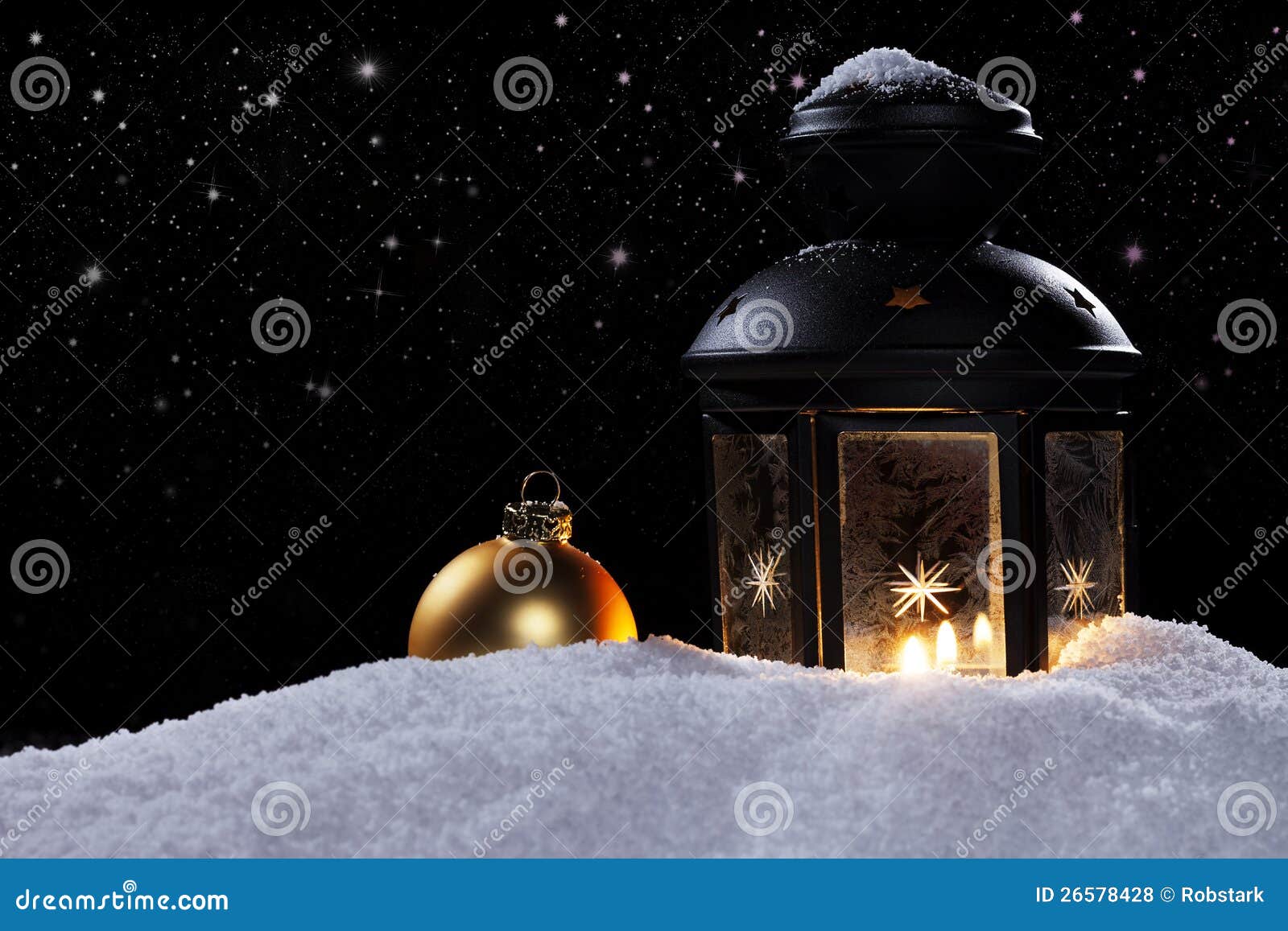 Lantern in a night with stars and a christmas ball