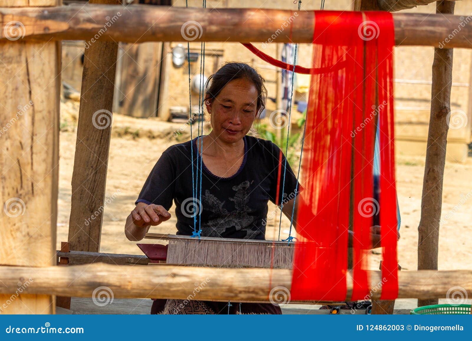 Female Fashion Designer Measuring and Cutting Fabric before Sewing