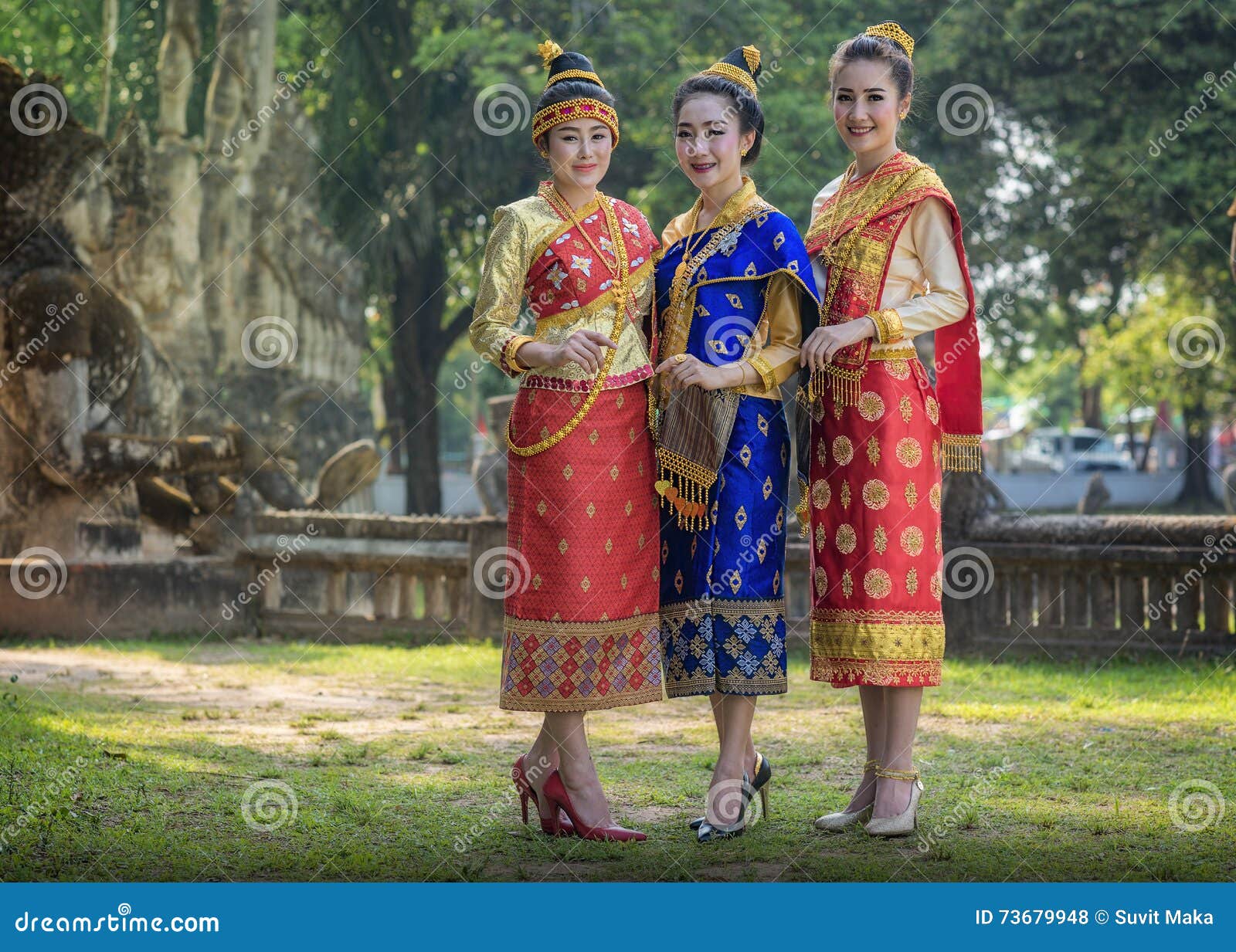 Laos Girl In Lao Traditional Clothing Goes On A Wooden Bridge Over The ...