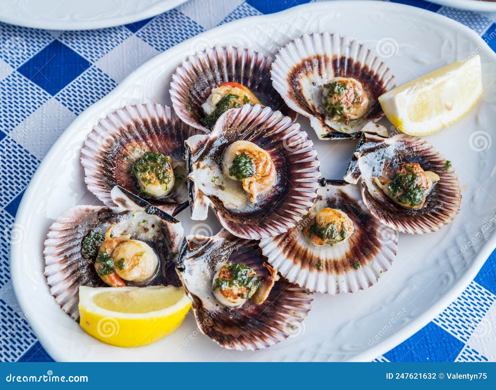 `lapas` or true limpets with green moyo - traditional seafood of tenerife and madeira islands
