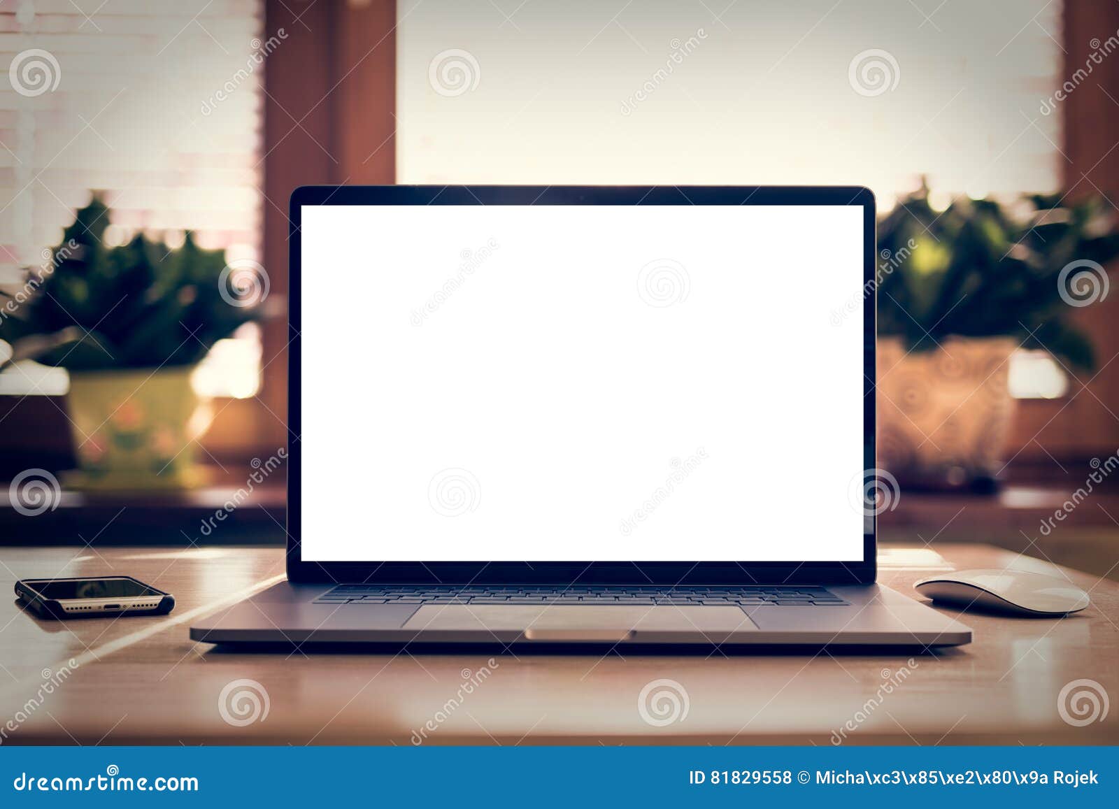 laptop with blank screen on table